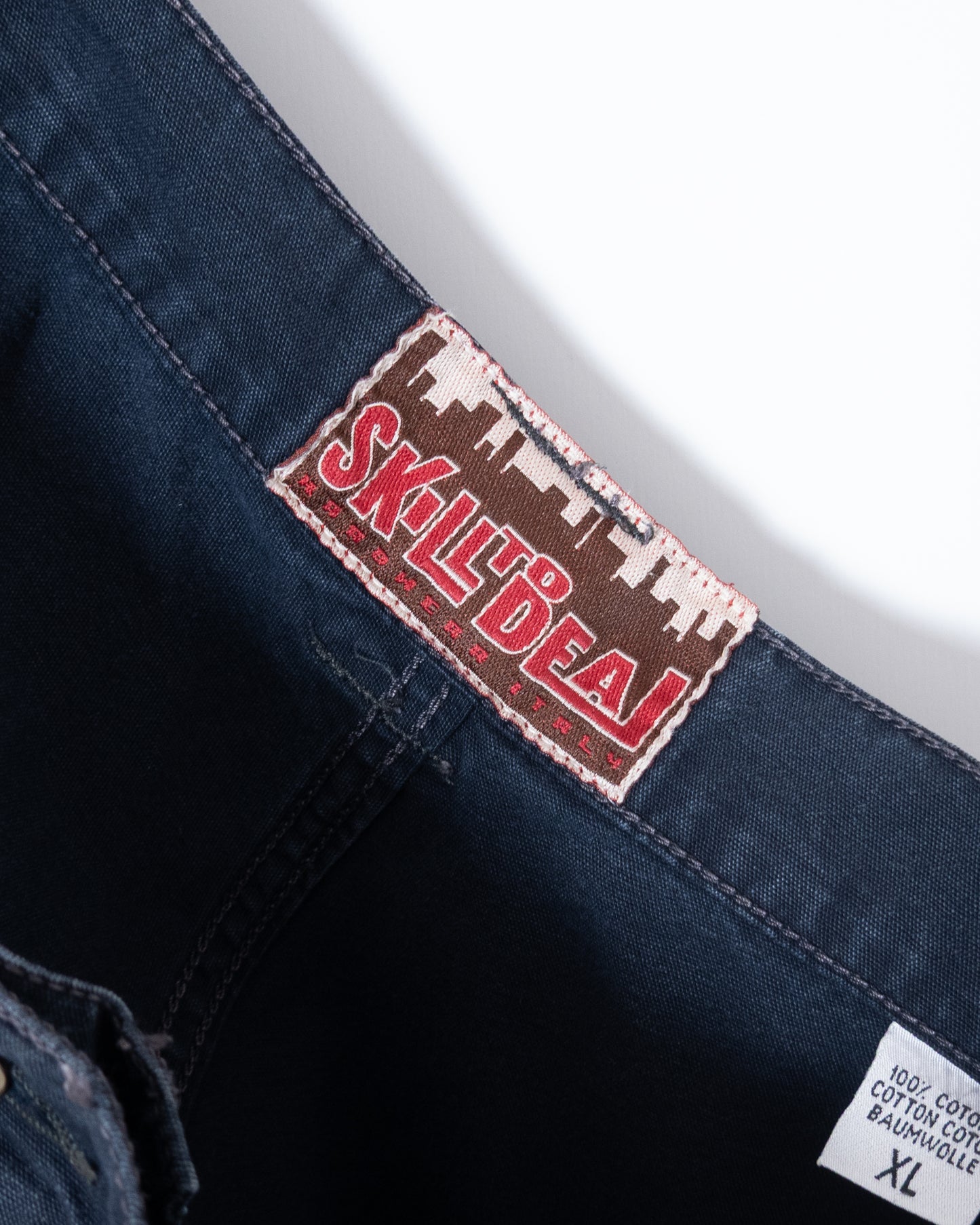 "SKILL TO DEAL" baggy shorts